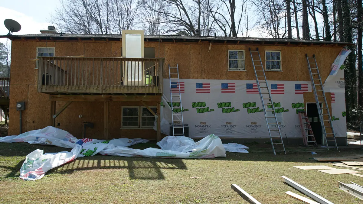 During: Back of a two-level Acworth home with a raised deck
