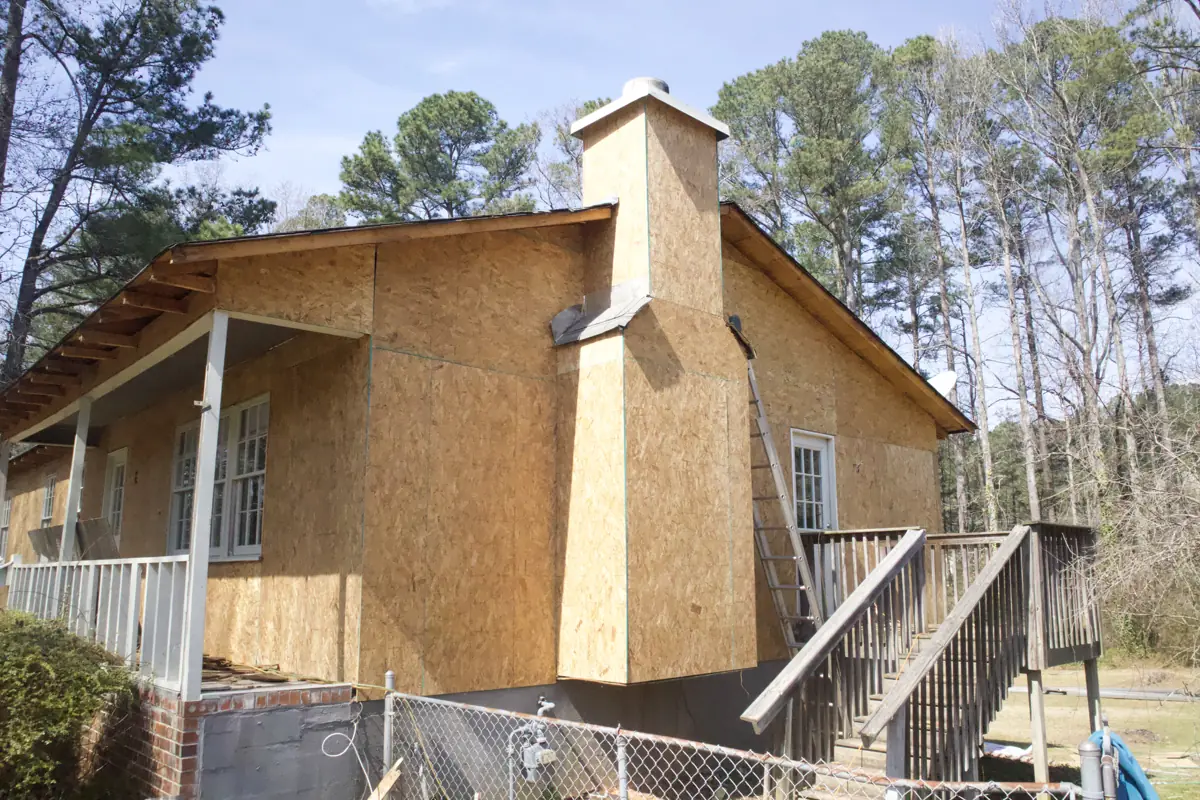 During: Porch and chimney side of a two-level Acworth home