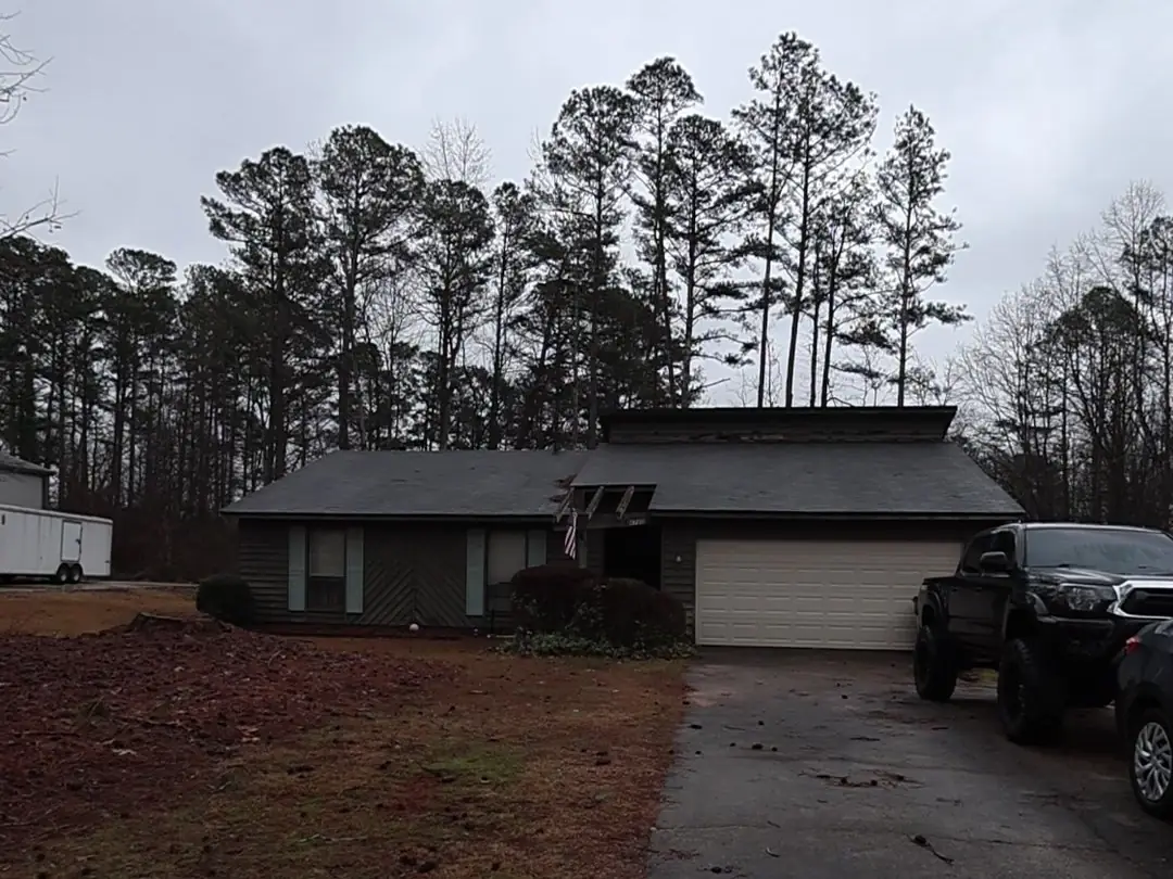 Before: Front of an Acworth ranch home