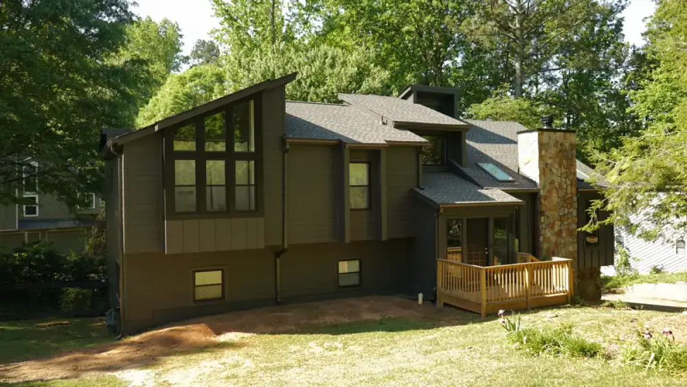 Same Marietta home transformed with dark olive-green James Hardie siding and black trim by Siding Depot