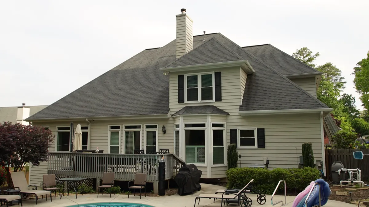Before: the back of the house above the pool.