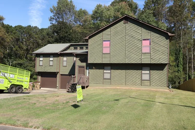 Before: original diagonal wood siding on the front of the house.