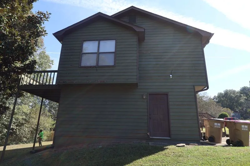 Before: side of the house, original worn siding.