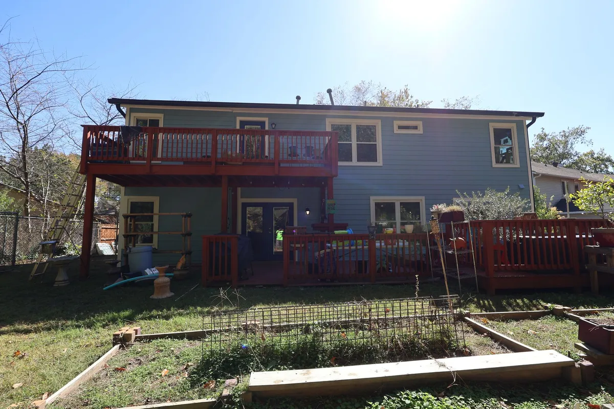 After: the same rear elevation in blue.