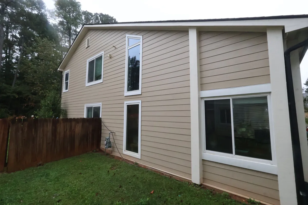 Before: side wall in the old beige siding.