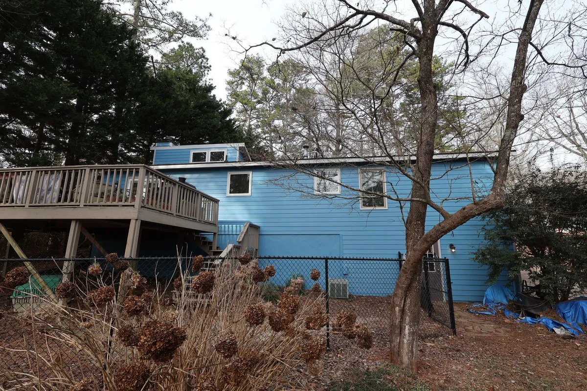 After: the same rear elevation in blue.