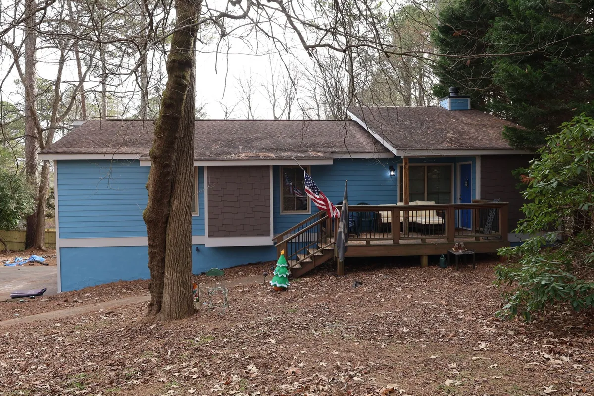 After: the same front in blue siding.