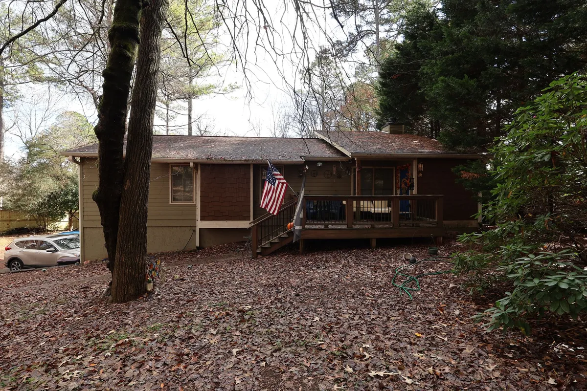 Before: the front of the ranch home and deck.