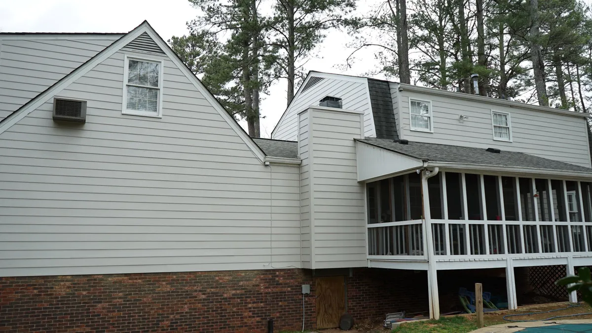 After: the same rear elevation in white.