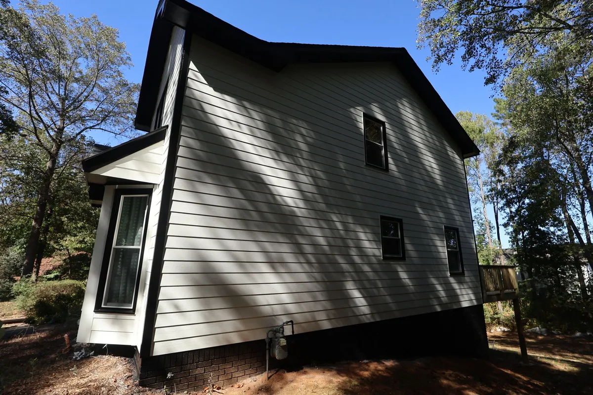 After: the same side finished in white with black trim.